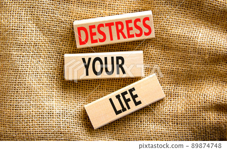 Destress your life symbol. Concept words Destress your life on wooden blocks. Beautiful canvas table canvas background. Psychological business and destress your life concept. Copy space. 89874748