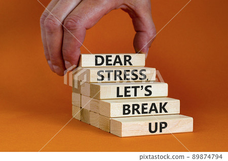 Stress break up symbol. Concept words Dear stress let is break up on wooden blocks. Businessman hand. Beautiful orange table and background. Business motivational stress break up concept. Copy space. 89874794