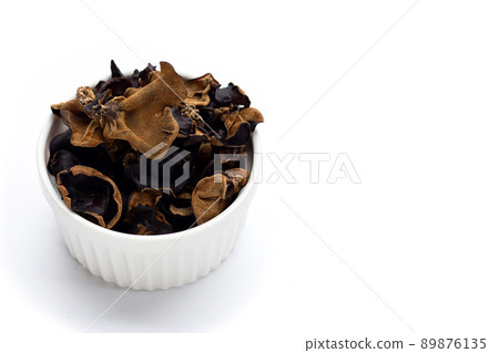 Dried black fungus on white background. Dried black fungus on white background. 89876135