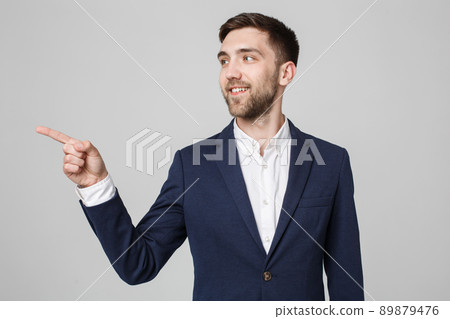 Business Concept - Portrait Handsome Business man confident smile pointing with finger. White Background. 89879476