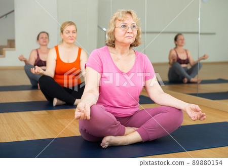 Women are exercising lotus pose Women are exercising lotus pose 89880154