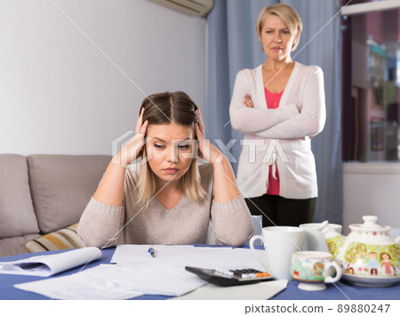 Mother scolds her adult daughter Mother scolds her adult daughter 89880247