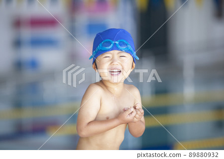 Boys swimming in the pool 89880932