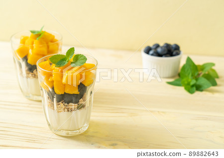 homemade mango and blueberry with yogurt and granola 89882643