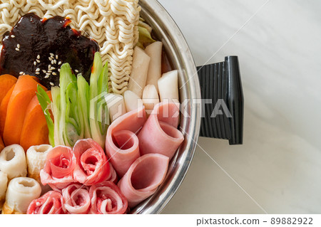 Budae Jjigae or Budaejjigae (Army stew or Army base stew). It is loaded with Kimchi, spam, sausages, ramen noodles and much more Budae Jjigae or Budaejjigae (Army stew or Army base stew). It is loaded with Kimchi, spam, sausages, ramen noodles and much more 89882922