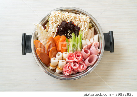 Budae Jjigae or Budaejjigae (Army stew or Army base stew). It is loaded with Kimchi, spam, sausages, ramen noodles and much more Budae Jjigae or Budaejjigae (Army stew or Army base stew). It is loaded with Kimchi, spam, sausages, ramen noodles and much more 89882923