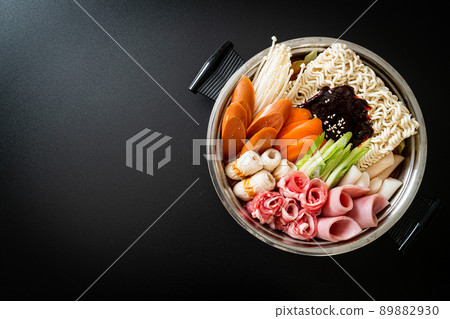 Budae Jjigae or Budaejjigae (Army stew or Army base stew). It is loaded with Kimchi, spam, sausages, ramen noodles and much more 89882930