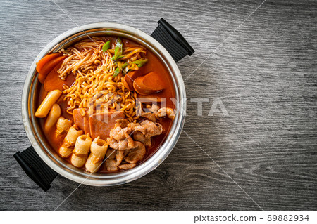 Budae Jjigae or Budaejjigae (Army stew or Army base stew). It is loaded with Kimchi, spam, sausages, ramen noodles and much more Budae Jjigae or Budaejjigae (Army stew or Army base stew). It is loaded with Kimchi, spam, sausages, ramen noodles and much more 89882934