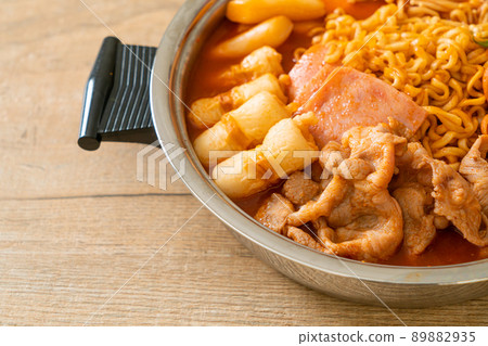 Budae Jjigae or Budaejjigae (Army stew or Army base stew). It is loaded with Kimchi, spam, sausages, ramen noodles and much more Budae Jjigae or Budaejjigae (Army stew or Army base stew). It is loaded with Kimchi, spam, sausages, ramen noodles and much more 89882935