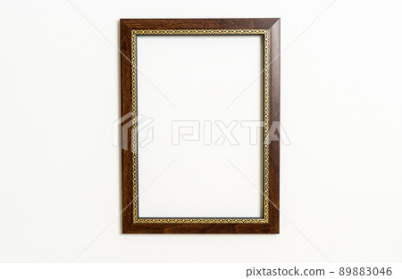 empty picture frame on white wall background 89883046