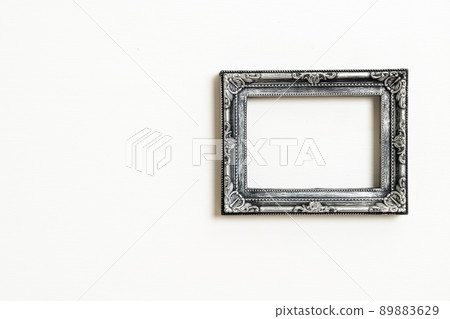 empty picture frame on white wall background empty picture frame on white wall background 89883629