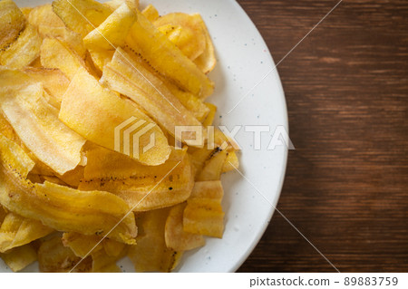 Banana Chips - fried or baked sliced banana Banana Chips - fried or baked sliced banana 89883759