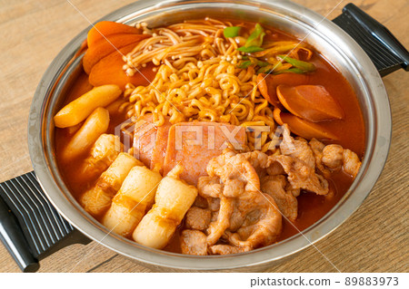 Budae Jjigae or Budaejjigae (Army stew or Army base stew). It is loaded with Kimchi, spam, sausages, ramen noodles and much more Budae Jjigae or Budaejjigae (Army stew or Army base stew). It is loaded with Kimchi, spam, sausages, ramen noodles and much more 89883973