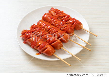 fried sausage skewer with ketchup fried sausage skewer with ketchup 89883995