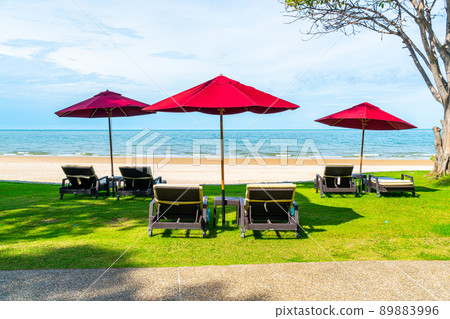 beach chair and umbrella with sea beach background beach chair and umbrella with sea beach background 89883996