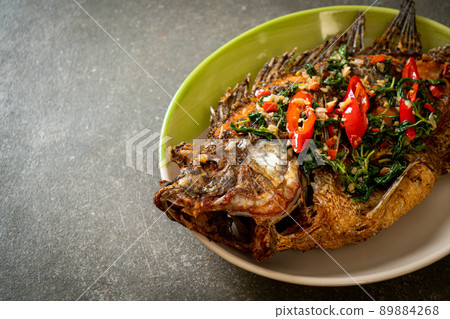Fried Tilapia Fish with Basil chili garlic sauce 89884268