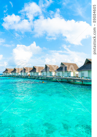 tropical Maldives resort hotel and island with beach and sea for holiday vacation concept 89884605