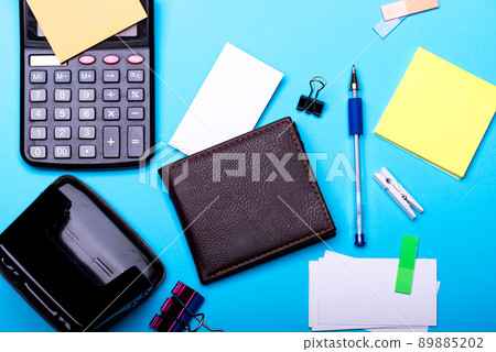 Business card and binders near sticky notes. Business accessories Business card and binders near sticky notes. Business accessories 89885202