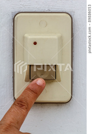 Close up doorbell in front of home 89886053