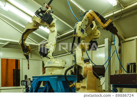 Robots welding in parts industry Robots welding in parts industry 89886724