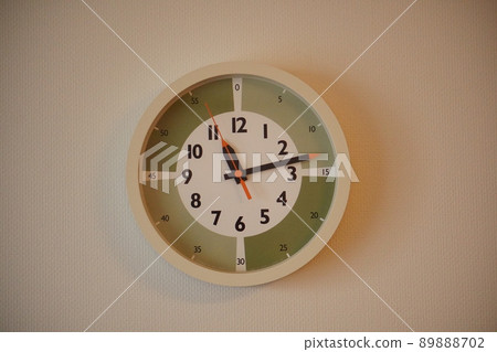 Educational clock hanging on the wall Educational clock hanging on the wall 89888702