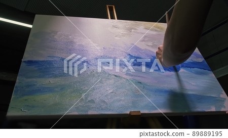 Artist copyist paint seascape with ship in ocean. Craftsman decorator draw as boat sail on blue sea with acrylic oil color. Draw brush, knife palette. 89889195