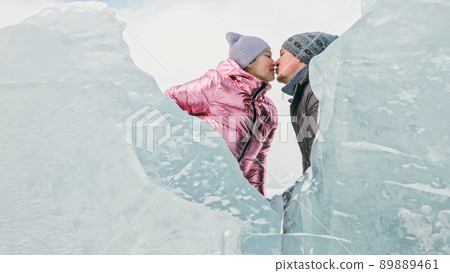 Couple has fun during winter walk against background of ice of f 89889461