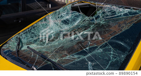 Broken windshield of a car 89890154