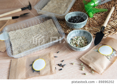 Microgreen seeds in paper bags and equipment for sowing microgreens. Microgreen seeds in paper bags and equipment for sowing microgreens. 89890202