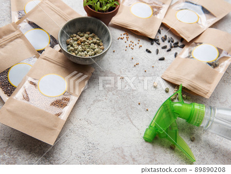 Microgreen seeds in paper bags and equipment for sowing microgreens. Microgreen seeds in paper bags and equipment for sowing microgreens. 89890208