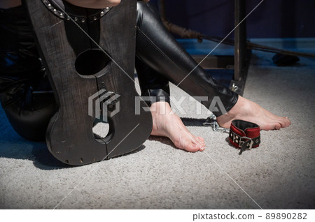 Female hands in wooden shackles during  Stock Photo 89890282  