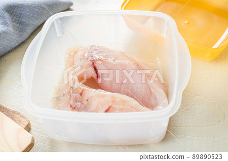 Fillet of cod before lentin in a heat-resistant container Fillet of cod before lentin in a heat-resistant container 89890523