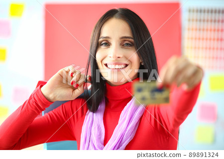 Smiling woman hold credit card, best option for contactless payment, saveup money Smiling woman hold credit card, best option for contactless payment, saveup money 89891324
