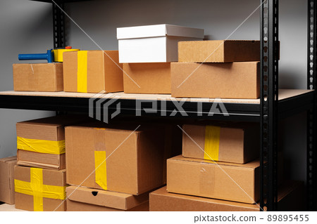 Rack shelves with paper boxes in warehouse. Rack shelves with paper boxes in warehouse. 89895455