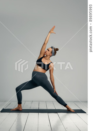 Prenatal Gymnastics. Young Pregnant Woman Training At Home, Doing exercise On Fitness Mat In Living Room, Expecting Lady Enjoying Healthy Lifestyle, Side View, Copy Space Prenatal Gymnastics. Young Pregnant Woman Training At Home, Doing exercise On Fitness Mat In Living Room, Expecting Lady Enjoying Healthy Lifestyle, Side View, Copy Space 89895993