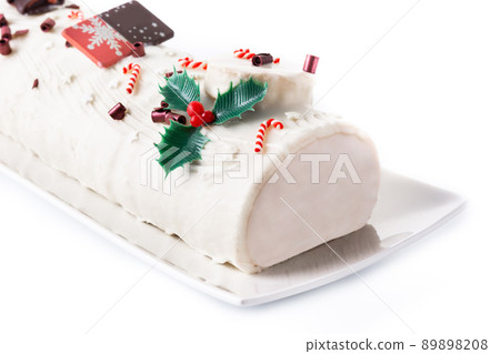 White chocolate yule log cake with ornament 89898208