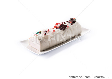 White chocolate yule log cake with ornament White chocolate yule log cake with ornament 89898209