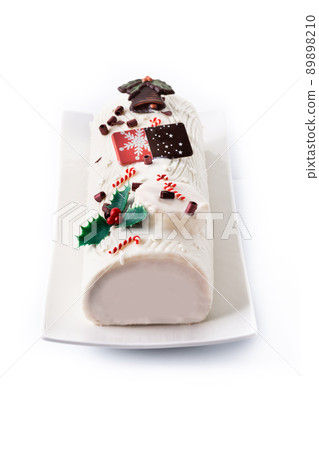 White chocolate yule log cake with ornament 89898210