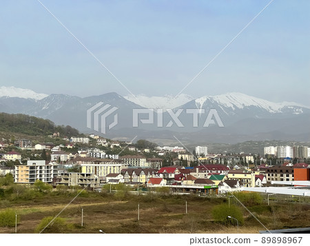 City on the background of high years with glaciers City on the background of high years with glaciers 89898967