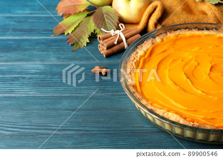 Concept of tasty food with pumpkin pie on wooden background Concept of tasty food with pumpkin pie on wooden background 89900546