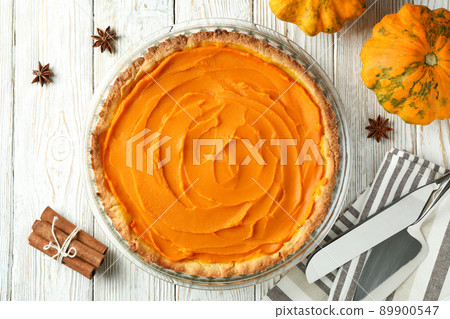 Concept of tasty food with pumpkin pie on white wooden background 89900547