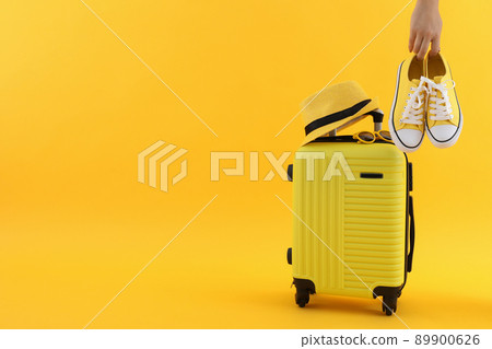 Composition with travel accessories on yellow background 89900626