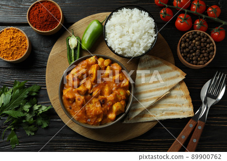 Concept of tasty food with chicken tikka on wooden background 89900762