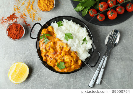 Concept of tasty food with chicken tikka on gray textured background 89900764