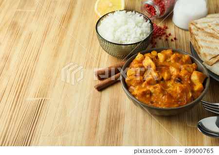 Concept of tasty food with chicken tikka on wooden background 89900765