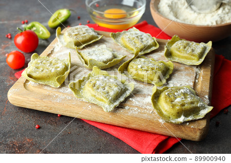 Concept of cooking ravioli on dark background Concept of cooking ravioli on dark background 89900940