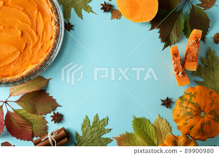 Concept of tasty food with pumpkin pie on blue background Concept of tasty food with pumpkin pie on blue background 89900980