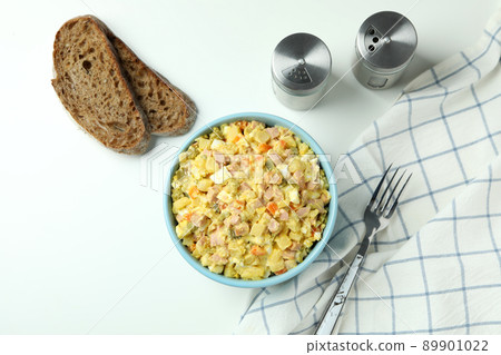 Concept of tasty food with Olivier salad on white background Concept of tasty food with Olivier salad on white background 89901022