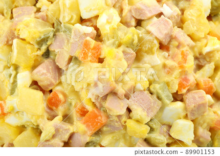 Olivier salad all over background, close up Olivier salad all over background, close up 89901153