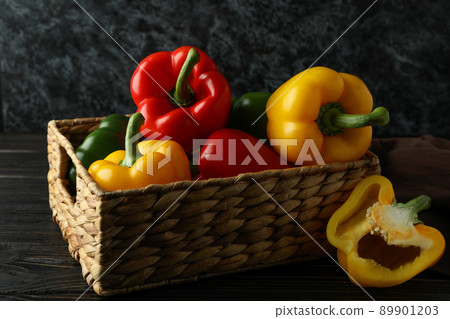 Concept of tasty food with bell pepper on wooden table Concept of tasty food with bell pepper on wooden table 89901203